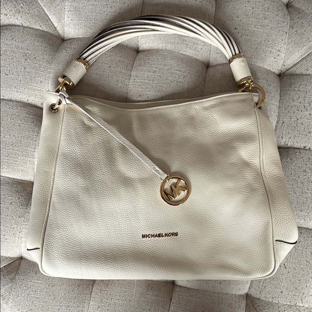 Michael Kors Cream Hand Bag with Twist Strap Design and Gold Accents
